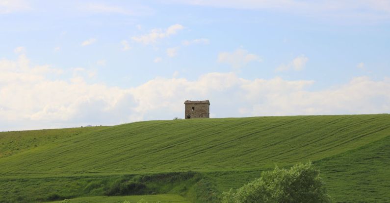 Roman Countryside - Concrete Structure on the Grass Field