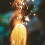 Roman Designers - Bright firework candle burning on blurred background in evening