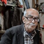 Tailored Services - Portrait of a Senior Man in an Old Fashioned Tailoring Studio